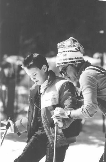 Hal O'Leary, NSCD's Founder, with a participant getting ready to ski with outriggers